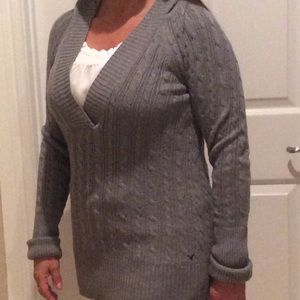 Gray sweater with a hood.